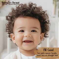 Boogie and Bean Coco Baby Hair Oil on curly baby hair—tames frizz and adds softness.