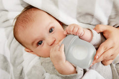 Boon Nursh dishwasher-safe gray bottle enables quick cleanup after feeds.