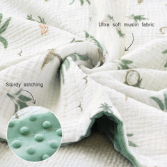 BOPRIO muslin blanket on baby bed showcasing size and softness.