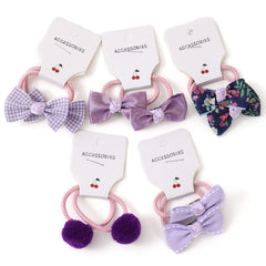 BOUNIQ hair ties with bows in a mix of solids and patterns for little girls.