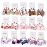 BOUNIQ baby hair ties with bows in assorted colors offering gentle hold for everyday outfits.