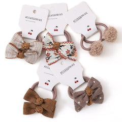 BOUNIQ toddler hair bands with bows, 1.5-inch bows, secure ponytails during active play.