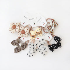 BOUNIQ toddler hair ties 1-2 inch elastics with 1.5 inch bows for gentle hold.