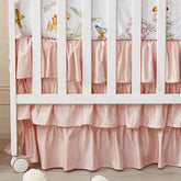 Brandream blush pink shabby chic crib skirt closeup showcasing soft 100% Egyptian cotton feel for a cozy nursery