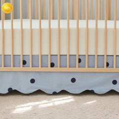 Brandream scallop edge crib skirt in mist blue fabric adds gender-neutral color to the nursery.