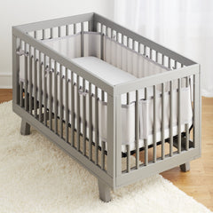 BreathableBaby crib liner long-panel installation showing 4-sides coverage and easy fit.