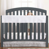 BreathableBaby railguard long panel cover on crib rail for teething protection.