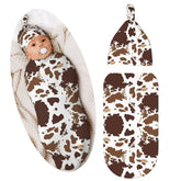 Broiteid cow-print swaddle bag helps newborns feel snug and soothed for sleep.
