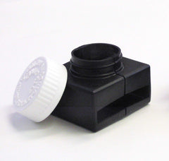Close-up of the Buckle Guard push-and-turn cap on a buckle.