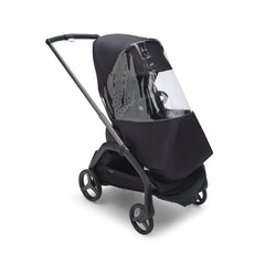 Bugaboo Dragonfly rain cover on stroller provides wind protection with clear visibility.