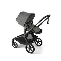 Bugaboo Kangaroo Moon Grey stroller on urban terrain for versatile family outings.