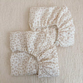 BuLuTu cotton muslin crib sheet close-up shows soft breathable fabric for baby comfort.