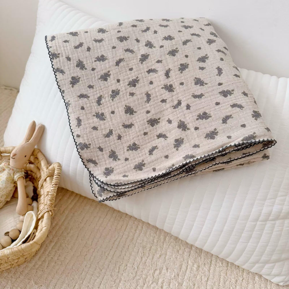 BuLuTu Shabby Chic Orchid Blanket close-up highlights soft double-layer muslin for gentle skin contact.