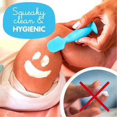 Bumco Mini Spatula suction base holds upright during diaper changes.