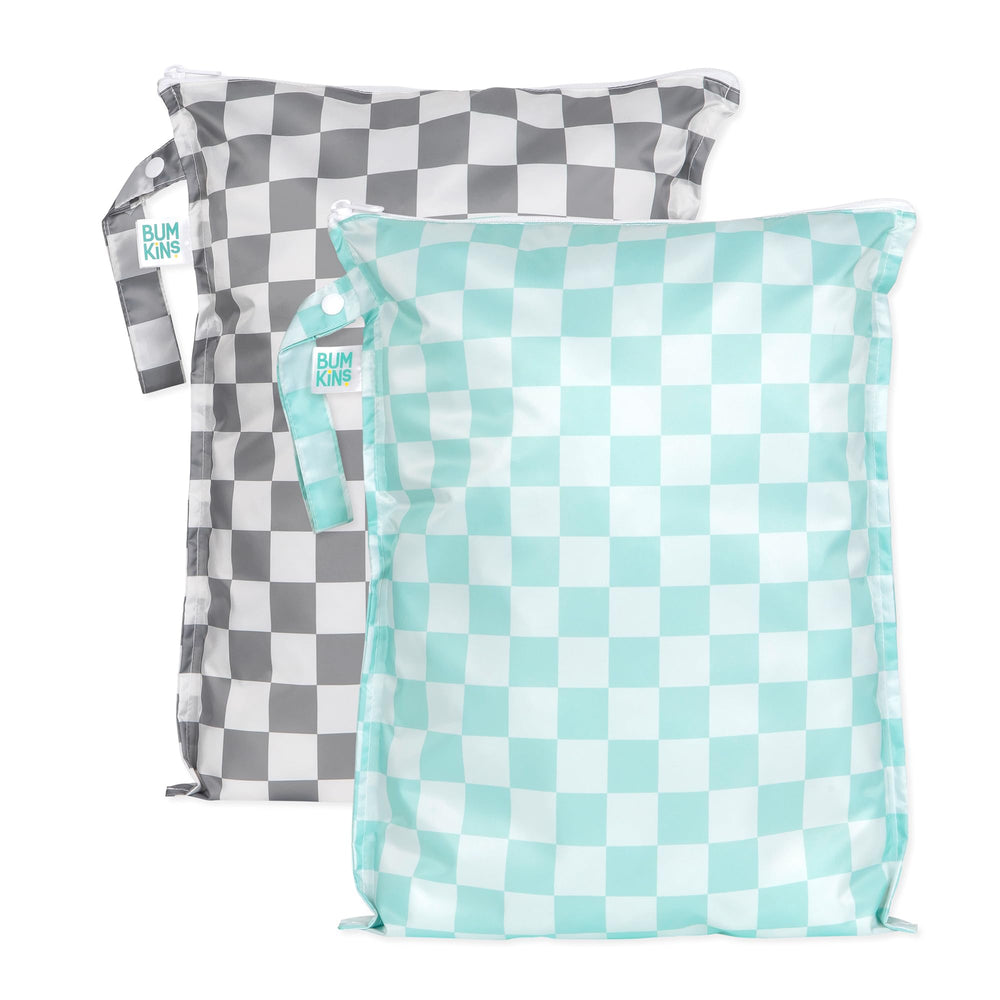 Bumkins larger wet bag gray-check strapped to stroller for travel organization.