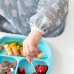 Bumkins sleeved bib gray arrows back closure keeps baby snug during self-feeding.
