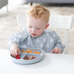 Bumkins sleeved bib gray arrows waterproof fabric resists stains during busy mealtimes.