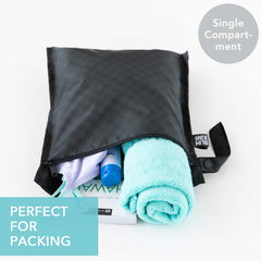 Bumkins waterproof wet-dry clutch closed keeps travel essentials dry on the go.