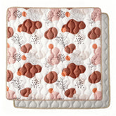 Bunnikins & Clover baby play mat folded compact for storage and portability.