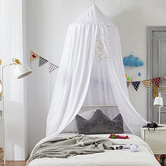 Bunnikins & Clover white canopy transforms a nook into a dreamy reading corner.