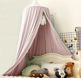 Bunnikins & Clover bed canopy round dome mosquito net keeps bugs out while framing a cozy sleep space.