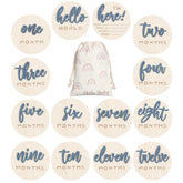 Burbell milestone discs wood captures baby's monthly growth moments in photos.