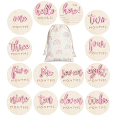 Burbell 7-pack pink milestone discs capture baby's growth milestones in photos.