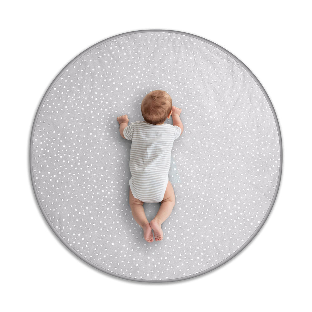 Byrd and Blume round baby play mat gray folded for travel with cushioned comfort.