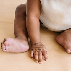 Cairn vegan leather baby changing mat opened to 16x26 inches for comfortable diaper changes.
