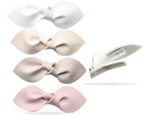 California Tot ivory bow clip on a baby hairstyle for versatile everyday wear.