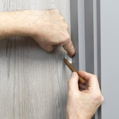 Cardea Solutions hinge protector bridges door and frame for safer door use
