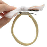 Catin super-soft nude headbands closeup showing gentle nylon fabric for newborn comfort.