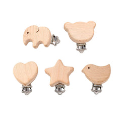 ccHuDE natural wood pacifier clip teether-attachment shows easy attachment to toys and clothing