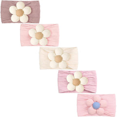 CÉLLOT pink baby flower headbands closeup showing soft nylon stretch for growing heads.