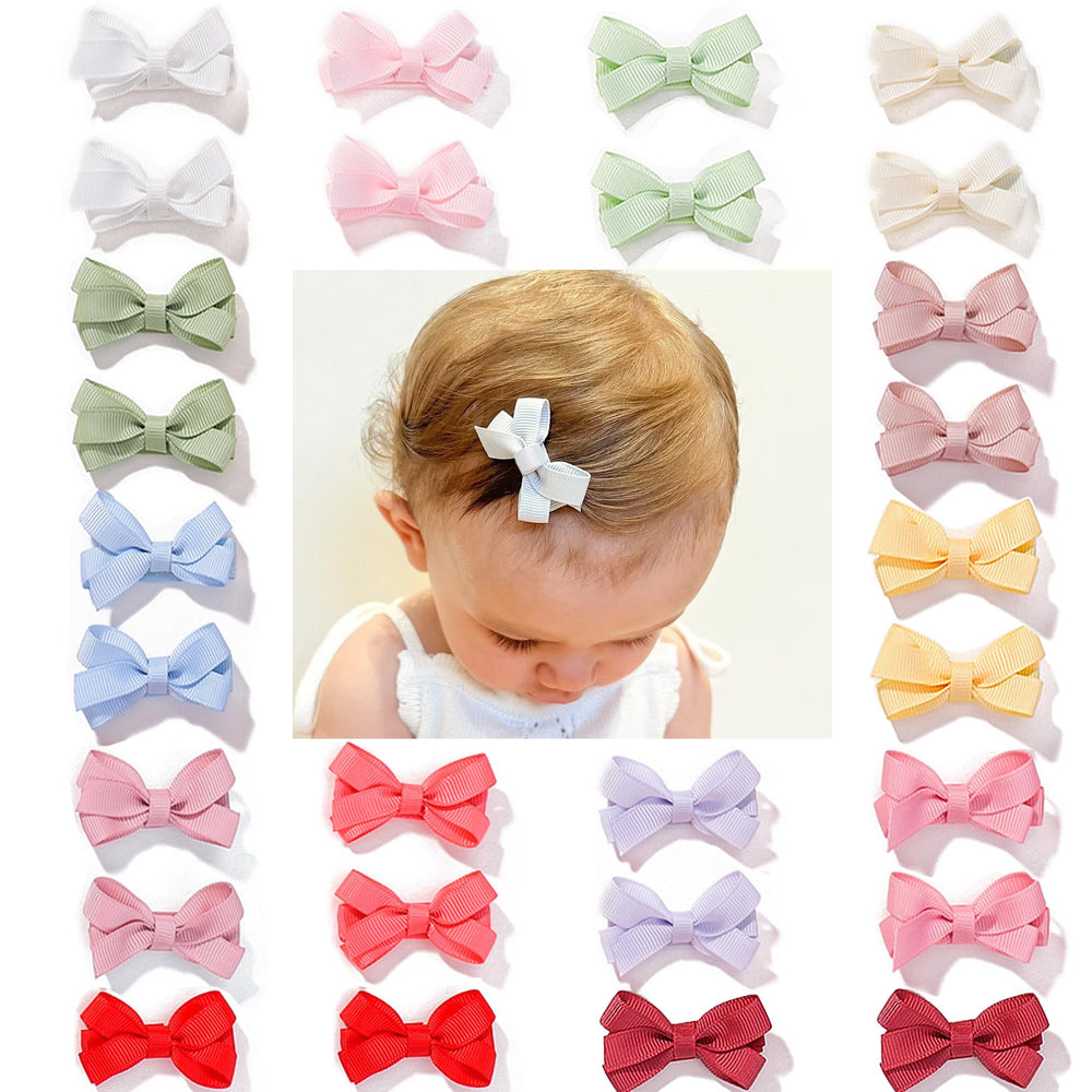 CellElection 2-inch mini bow clip on top view for baby hair, gentle hold.