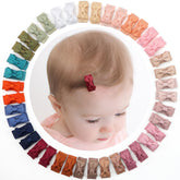 CÉLLOT mini-ribbon-clip close-up showing delicate 1.2-inch bow for fine hair