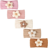 CÉLLOT baby flower headbands beige pink khaki laid flat for easy styling.
