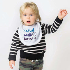 ChalkTalkSPORTS wrestling bib on baby demonstrates secure Velcro closure.