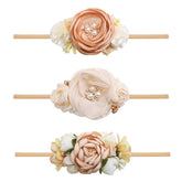 Cherrboll baby flower headband in soft nylon for newborn comfort and secure fit.