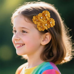 Cherrboll flower hair clip with pearl accents adds delicate elegance.