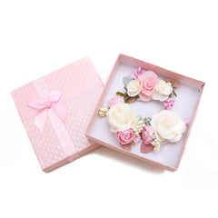 Cherrboll pink flower hair clip close-up shows soft petals and pearl accents.