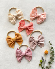 Cherssy bows in cream, khaki, pink, melon, mustard offer versatile styling with soft muslin.