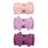 Chiduerm baby bows headband pink worn by a baby for gentle all-day comfort.