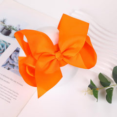 Chiduerm Halloween headband black bow on baby demonstrates secure elastic band for all-day wear
