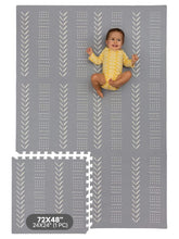 Childlike Behavior baby play mat assembly gray provides cushioned floor play surface.