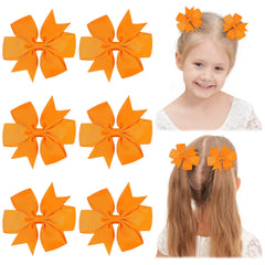 Choicbaby orange solid grosgrain pinwheel bow clip on a head for toddler style boost