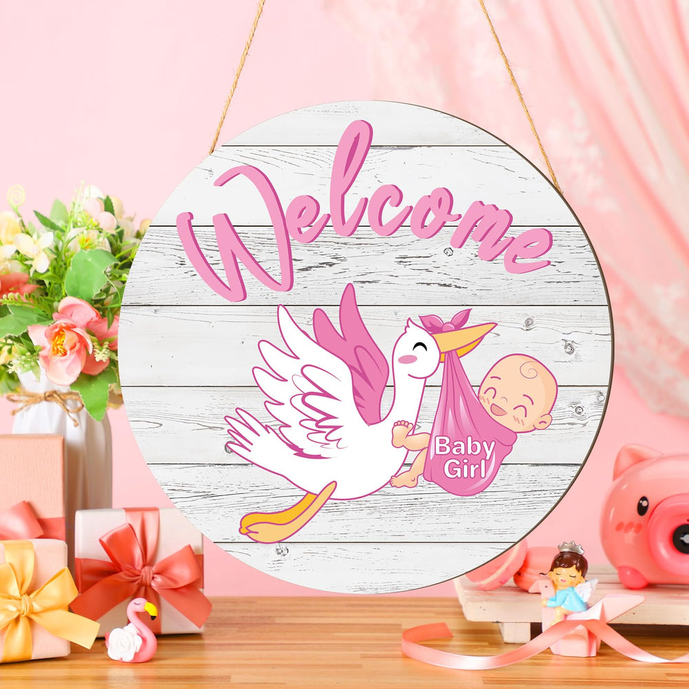 Chunful baby girl door sign round on front door welcomes guests.