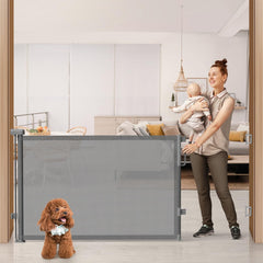 Cideny 76wide retractable gate extended across a doorway for wide openings and safety.