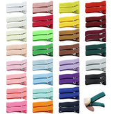 Cinaci small alligator clip in white securely grips fine hair with soft grosgrain finish.