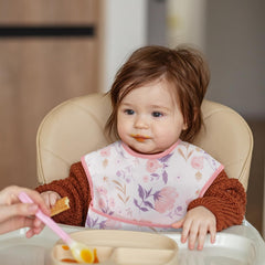Civarua Kids pink floral bib pocket detail showing reverse seam for easier flip